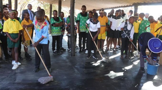 Boys are taught to mop the floor at the First Lady’s inaugural national boys camp in Mashonaland West yesterday