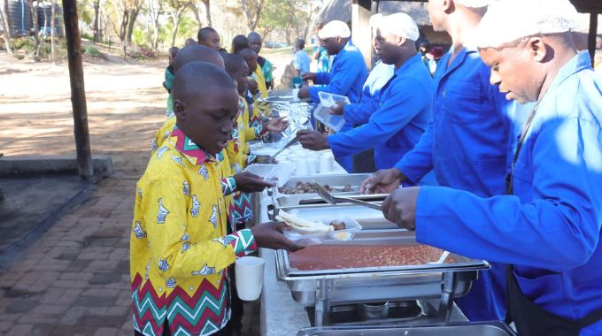 Boys drawn from the country’s 10 provinces being served breakfast at the First Lady’s inaugural national boys camp organised by First Lady Dr Auxillia Mnangagwa in Mashonaland West yesterday