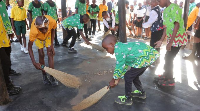 Boys are taught to sweep the floor after breakfast at the First Lady’s inaugural national boys camp in Mashonaland West yesterday