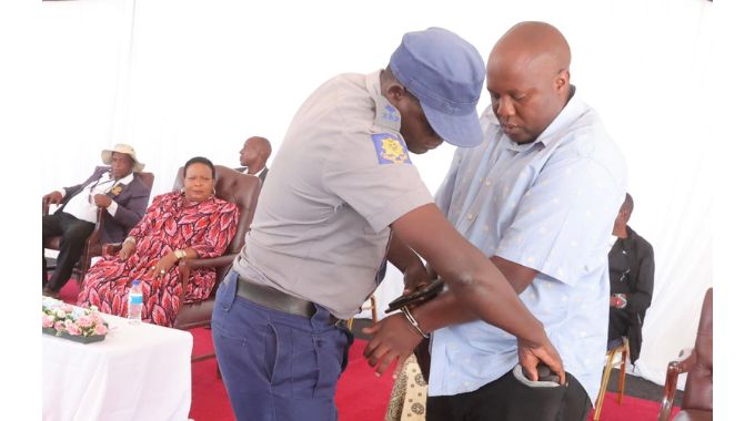 A police officer demonstrates how policemen arrest criminals during a career guidance programme organised by First Lady Dr Auxillia Mnangagwa at her inaugural national boys camp. – Pictures: John Manzongo.