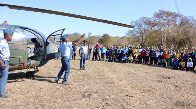 Air Force of Zimbabwe pilots and technician show participants attending the First Lady’s national boys camp how a helicopter is flown during a career guidance programme organised by First Lady Dr Auxillia Mnangagwa.