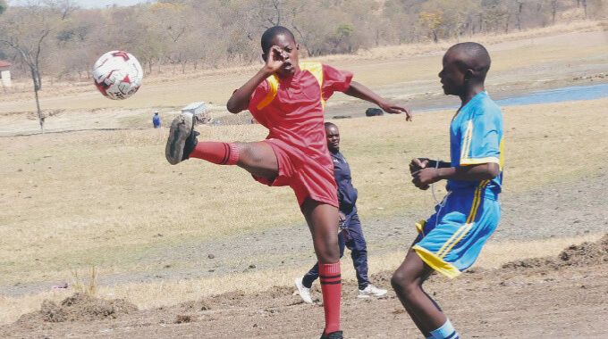 Boys play soccer during the First Lady’s national boys camp