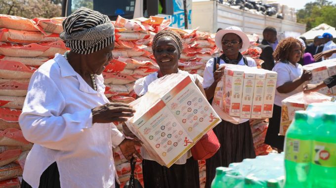 Widows pack some of the groceries for start up businesses they received from First Lady Dr Auxillia Mnangagwa during the launch of First Lady’s Widows Association Matabeleland Chapter in Bulawayo