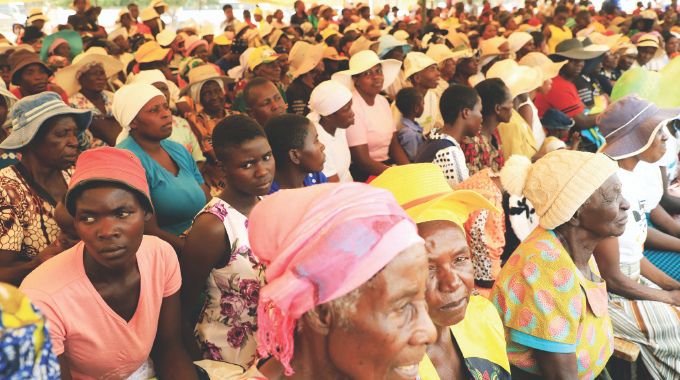 Parents and members of the community follow proceedings during their interactive session with Health Ambassador First Lady Dr Auxillia Mnangagwa at her school feeding programme in Mashonaland East yesterday