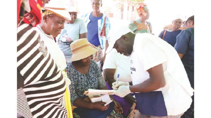 Women being checked for blood pressure and other ailments during a mobile medical outreach for women, courtesy of Angel of Hope Foundation patron First Lady Dr Auxillia Mnangagwa.