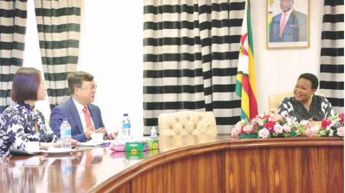 First Lady Dr Auxillia Mnangagwa interacts with Chinese Ambassador to Zimbabwe Zhou Ding and his wife Madam Lyu Renhong during a courtesy call at Zimbabwe House.