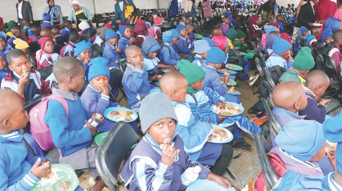 Learners enjoy their meal which was prepared and served by First Lady Dr Auxillia Mnangagwa in Midlands