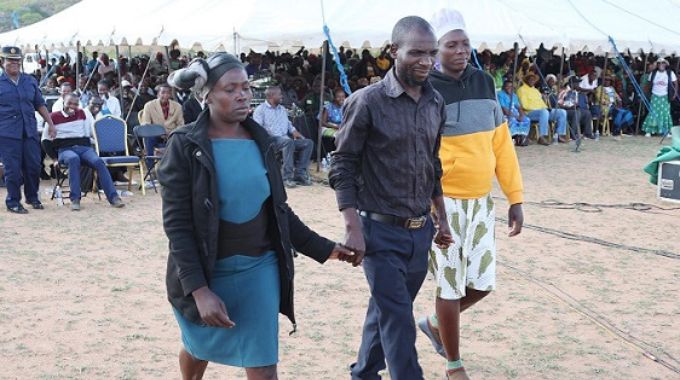 Mr Admire Moyondizvo, flanked by his two wives, Fadzai Rangarira and Emely Zvineyi, after First Lady Dr Auxillia Mnangagwa successfully mediated and brought harmony between his fighting spouses during the Afrikana Family Humanism Programme in Masvingo