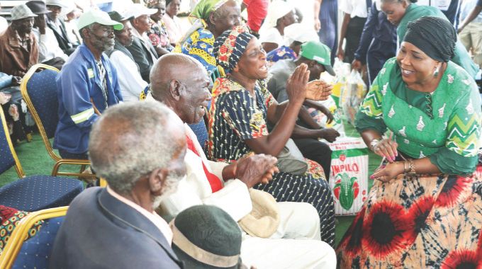 First Lady Dr Auxillia Mnangagwa interacts with the elderly as she handed them early Christmas hampers in Mashonaland West yesterday. – Pictures: John Manzongo