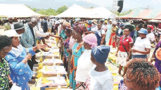 First Lady Dr Auxillia Mnangagwa distributes farming inputs to women during the launch of Pfumvudza4She, Banana4She, Horticulture4She Fisheries4She and Poultry4She in Honde Valley on Monday