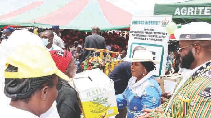 First Lady Dr Auxillia Mnangagwa distributes chicks to women during the launch of Poultry4She in Honde Valley, Manicaland on Monday