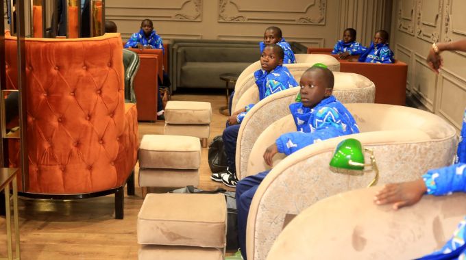 Children from Dr Auxillia Mnangagwa Children’s Home in Chambuta, Chiredzi sit in the VIP waiting area before departure for Russia at Robert Gabriel Mugabe International Airport in Harare on Monday