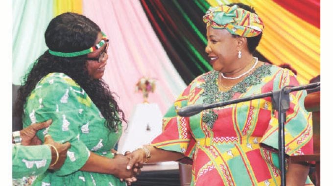 First Lady Dr Auxillia Mnangagwa greets Senator Rose Mpofu who is the Special Advisor on disability issues in the Office of the President and Cabinet in Chitungwiza yesterday.