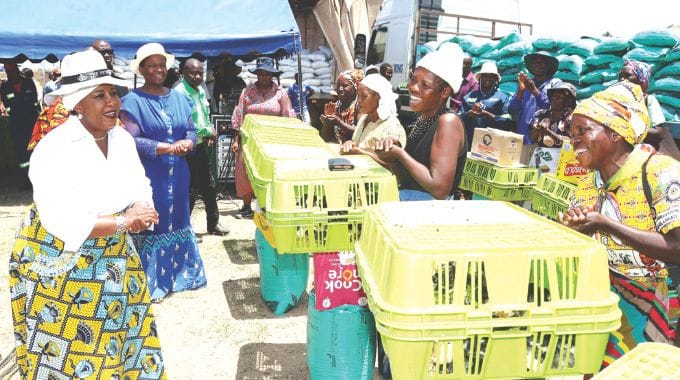 Agric4She patron First Lady Dr Auxillia Mnangagwa hands over more than 5 500 hybrid chicks and chickens, fertilizers and rice during the launch of Poultry4 Vanambuya empowerment scheme in Mashonaland West yesterday. — Pictures: John Manzongo