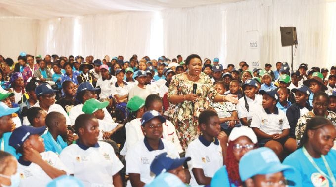 First Lady Dr Auxillia Mnangagwa teaches girls from Namibia, South Africa, Zambia, Botswana, Malawi, Mozambique and Zimbabwe good values, need to respect and preserve their bodies and value their education among other issues during and interactive nhanga/gota/ixhiba session she organised at the 2024 Regional World Children’s Day commemorations in Victoria Falls