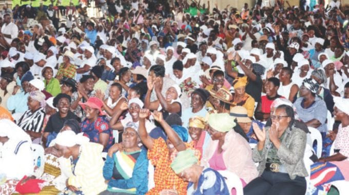 Women jubilantly follow proceedings during a combined interactive session with First Lady Dr Auxillia Mnangagwa at the launch of Afrikana family humanism programme in Harare yesterday