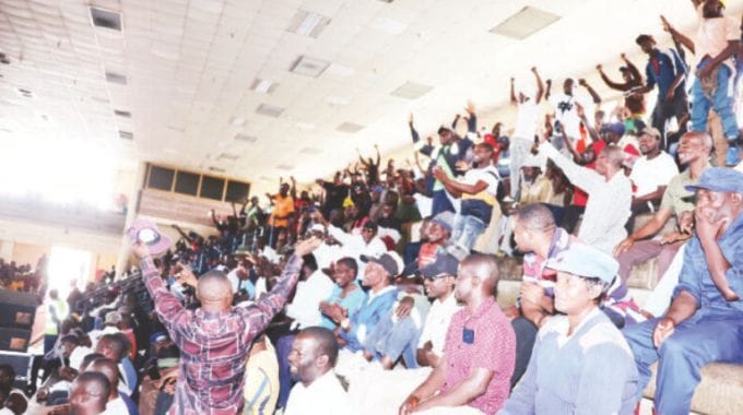 Men jubilantly follow proceedings during a combined interactive session with First Lady Dr Auxillia Mnangagwa during the launch of Afrikana family humanism programme in Harare yesterday