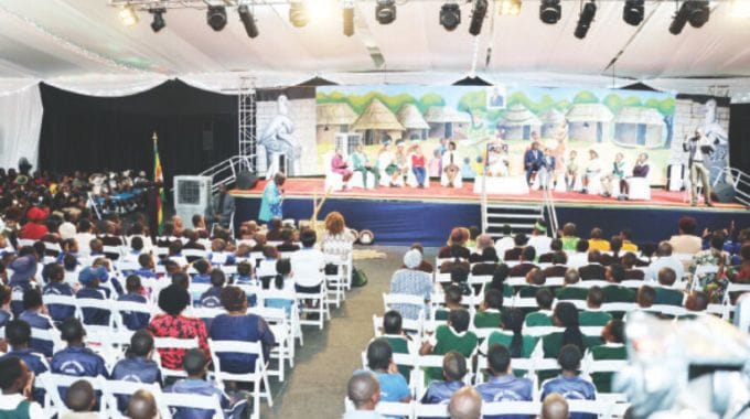 Schoolchildren follow proceedings during an interactive Zviperengo cultural quiz programme launched by First Lady Dr Auxillia Mnangagwa in Harare yesterday