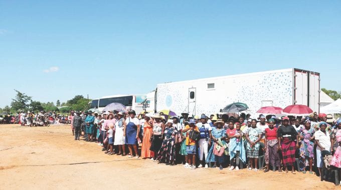 Women queue for cervical and breast cancer screening from Angel of Hope Foundation mobile hospital and mobile clinic during a medical outreach brought by Health Ambassador First Lady Dr Auxillia Mnangagwa in Gokwe yesterday