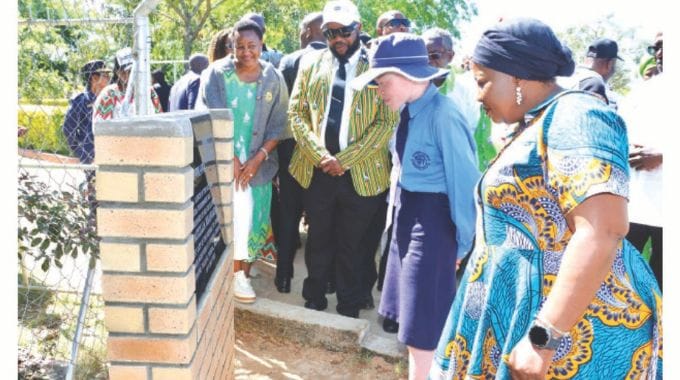 First Lady Dr Auxillia Mnangagwa, Minister of State and Devolution for Manicaland Advocate Misheck Mugadza and Deputy Minister Angeline Gata observe as a student reads a plaque during the launch of national Agro-Tourism4she in Manicaland yesterday