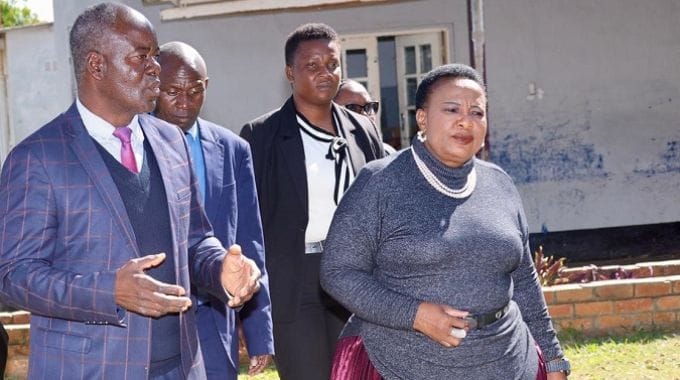 First Lady Dr Auxillia Mnangagwa being shown around Churchill School by headmaster Mr Aquanos Mazhunga on Friday