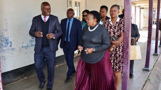 First Lady Dr Auxillia Mnangagwa, Ministry of Primary and Secondary Education officials, Churchill School SDA chairperson Ms Chipo Bessie Mahamba and headmaster Mr Aquanos Mazhunga tour the dormitories that were gutted by fire
