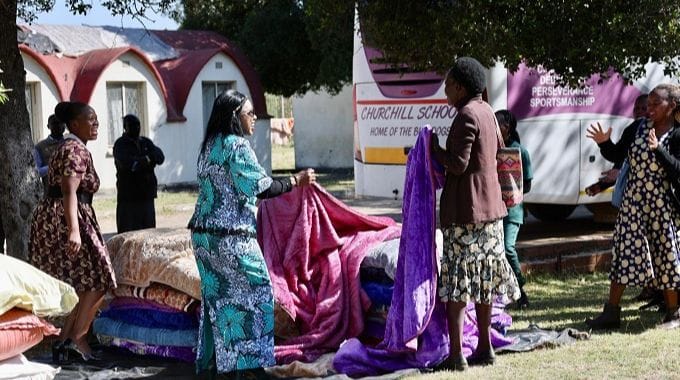 Churchill SDA chairperson Ms Chipo Bessie Mahamba, Sunningdale ZANU PF shadow legislator Cde Loice Magweba and schoolteachers pack blankets, mealie meal and an assortment of food items donated by Angel of Hope Foundation patron First Lady Dr Auxillia Mnangagwa to cushion children who lost their valuables in a fire. — Pictures: John Manzongo