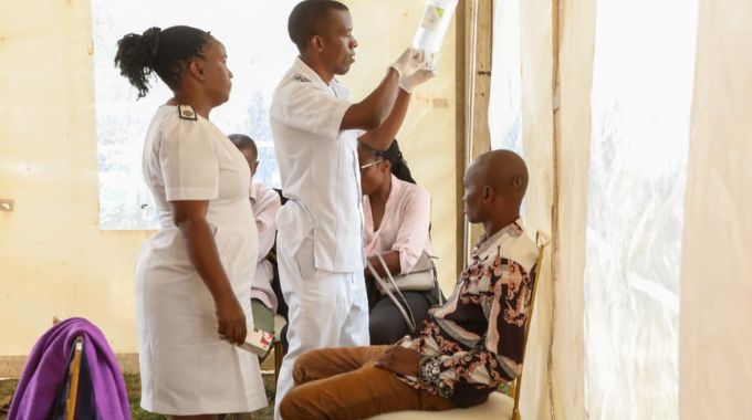 A patient receives an intravenous infusion from medical personnel during the vetting process at the Angel of Hope Foundation Drug Rehabilitation Centre.