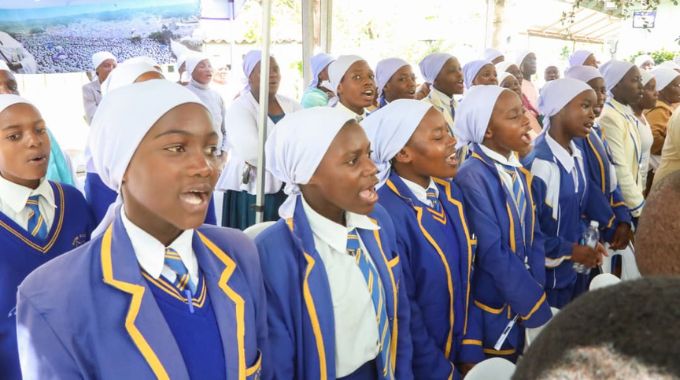 Learners sing a song in remembrance of Archbishop Paul Mwazha, revered founder of the African Apostolic Church.