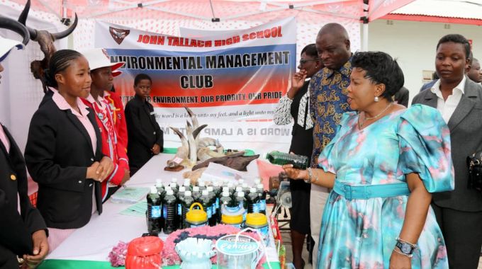 Environment Patron, First Lady Dr Auxillia Mnangagwa, looks at craft work, detergent-making, and other products by the John Tallach High School Environmental Club during a tour of the school’s projects as part of the Clean Schools Competition awards ceremony in Umguza District, Matabeleland North Province, yesterday