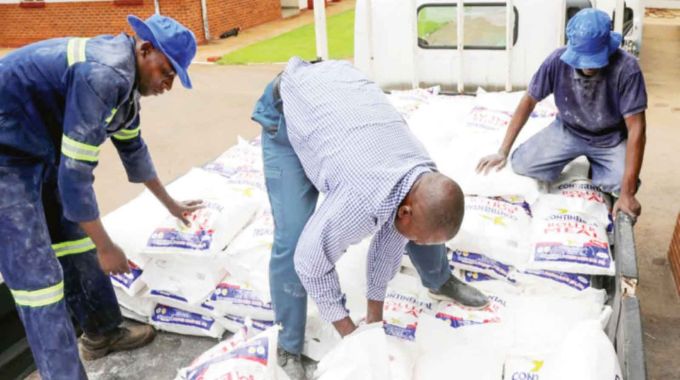 Personnel and staff from United Bulawayo Hospitals load a lorry with mealie-meal, part of the distributed goods including rice, wheat flour, beverages, and other essentials from First Lady Dr Auxillia Mnangagwa and her Angel of Hope Foundation partners