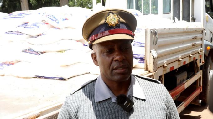 ZRP representative Inspector Webster Dzova thanks First Lady Dr Auxillia Mnangagwa for the distributed groceries to the police