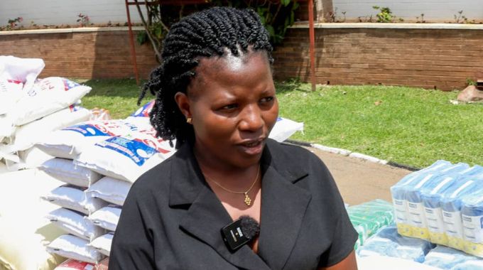 Ingutsheni Central Hospital representative Fortunate Nyamuremba expresses gratitude for the distributed goods including mealie-meal, rice, wheat flour, beverages, and other essentials at Zimbabwe House in Harare