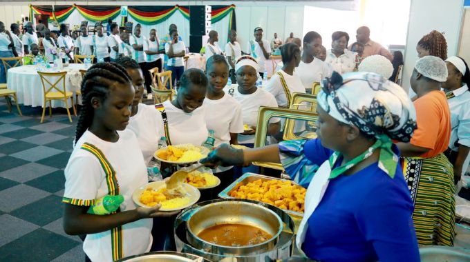 Children being served lunch during a party that was hosted by the First Lady Dr Auxillia Mnangagwa for orphaned and vulnerable children from across the country at the ZITF in Bulawayo yesterday