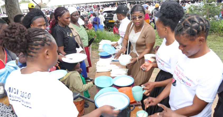 Women prepare porridge for children during the launch of the oversubscribed Toddlers’ Warm Bowl Project in Epworth