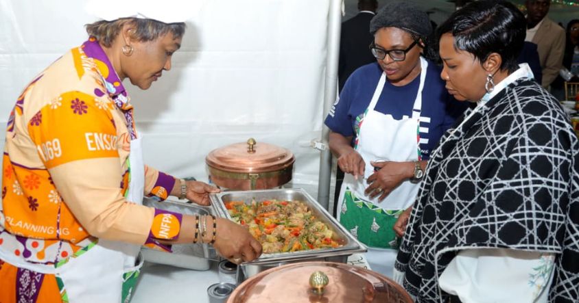 First Lady Dr Auxillia Mnangagwa is shown traditional dishes by UNDF Population Services Country Head Tabifor Miranda at Amai’s Gastronomy Kitchen, at the Zimbabwe International Trade Fair in Bulawayo