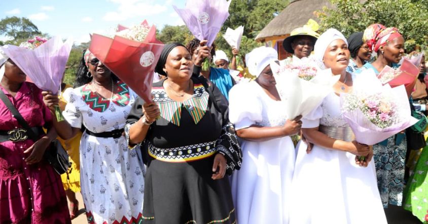 Women proudly display flowers received from First Lady during Mother’s Day celebrations at Baradzanwa Culture Centre