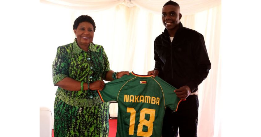 First Lady Dr Auxillia Mnangagwa receives a soccer jersey from Europe-based football star Marvelous Nakamba during a drug and substance abuse awareness campaign in Mbare, Harare