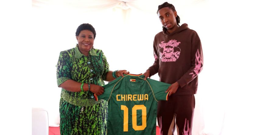 First Lady Dr Auxillia Mnangagwa receives a soccer jersey from Europe-based football star Tawanda Chirewa during a drug and substance abuse awareness campaign in Mbare, Harare