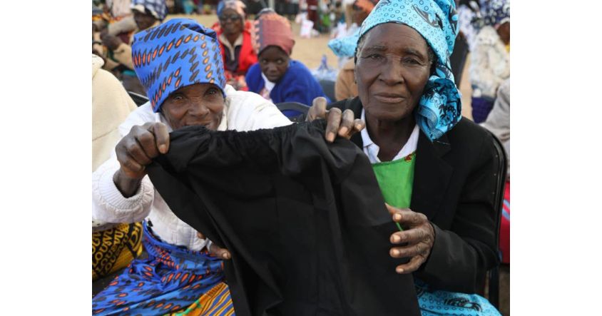 Elderly women and beneficiaries of the First Lady’s Doek Drive initiative display a petticoat while encouraging young girls to uphold and cherish Zimbabwean cultural values at Uswaushava Primary School in Chiredzi.