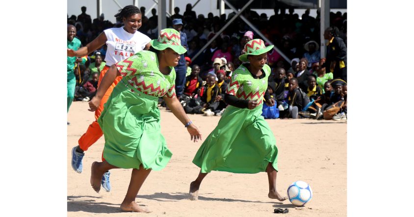 Women play soccer during First Lady’s interactive engagement at Mega Grounds.