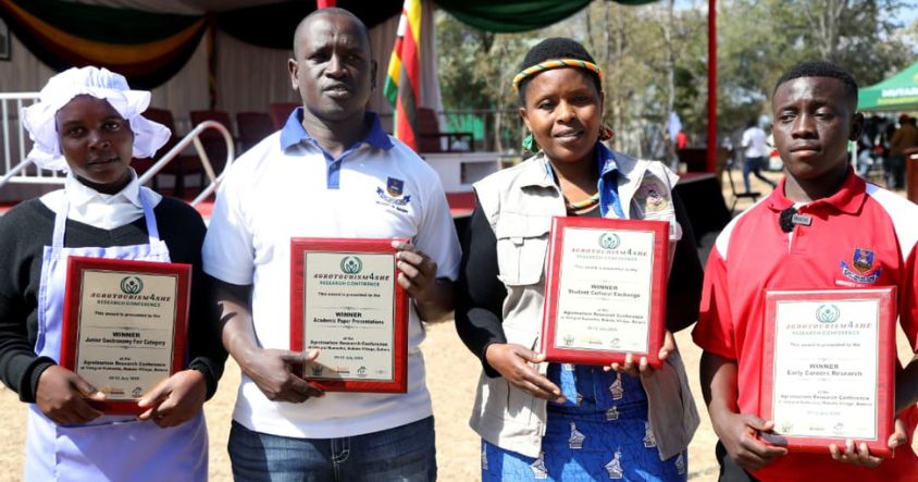 Winners in various categories of the Agri4SHE Agrotourism Research Conference display their certificates after being honoured at Mai Chimuti’s homestead in Mukoto, Buhera