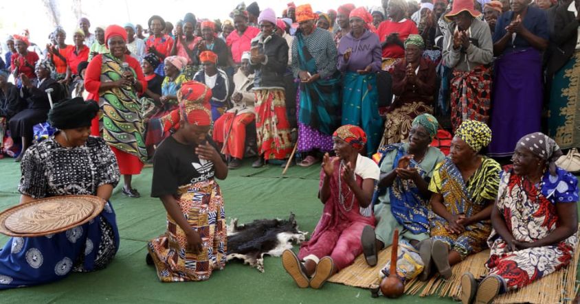 Culture and Heritage Ambassador First Lady Dr Auxillia Mnangagwa participates in the BaTonga cultural practice of a daughter-in-law serving a meal to her mother-in-law during the Matabeleland North Provincial Doek and Zambia Drive initiative in Binga. — Pictures: Justin Mutenda