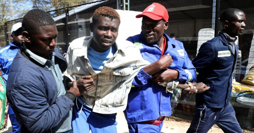 A battle for a new beginning . . . Officials struggle to admit a patient battling drug and substance abuse during the ninth intake of the Angel of Hope Drug Rehabilitation Programme in Mbare, Harare.