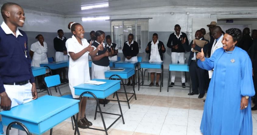 First Lady Dr Auxillia Mnangagwa greets students from the first intake of the Dr Auxillia Mnangagwa School of Nursing with a ZimBho gesture during the official opening of the institution in Kadoma