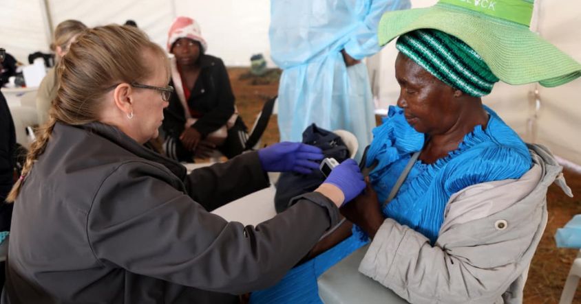 A doctor exermines a patient during the First Lady's medical outreach in Masvingo